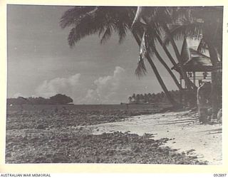 JACQUINOT BAY, NEW BRITAIN. 1945-06-10. LOOKING UP TOWARDS THE ENTRANCE TO JACQUINOT BAY. IN THE FOREGROUND IS THE GENERAL OFFICER COMMANDING'S OFFICE AND RESIDENCE; BACKGROUND TO THE RIGHT SHOWS ..