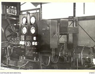 LAE AREA, NEW GUINEA. 1945-02-06. ONE OF THE TWO 25KVA ELECTRICITY GENERATING SETS AT THE WIRELESS TRANSMITTING CENTRE OF THE 19TH LINES OF COMMUNICATION SIGNALS, HEADQUARTERS, FIRST AUSTRALIAN ..