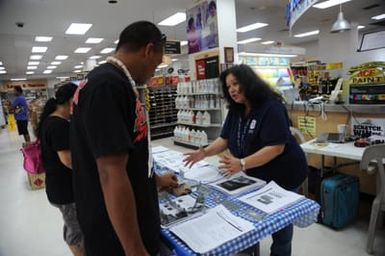 Melva Guzman-Cabrera, Human Services Specialist, educates Typhoon Soudelor survivors on mitigation rebuilding techniques for their homes.