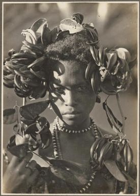 Girls from Village Wanigella [Wanigela], North Coast [girl in elaborate head dress] / Frank Hurley