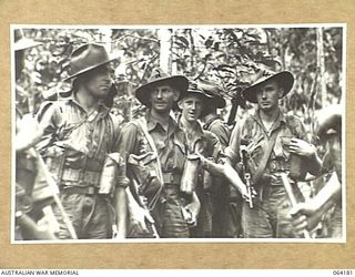 MOUNT PROTHERO AREA, NEW GUINEA. 1944-01-21. PERSONNEL OF THE 2/2ND PIONEER BATTALION WHO HAVE JUST RETURNED FROM A PATROL OF THE CANNING SADDLE AREA. IDENTIFIED PERSONNEL ARE:- NX88364 PRIVATE R. ..