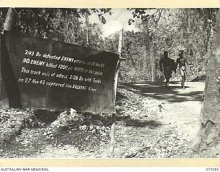 FINSCHHAFEN AREA, NEW GUINEA. 1944-03-13. ONE OF MANY BATTLE SIGNS IN THE FINSCHHAFEN AREA, THIS SIGN RECORDS ACTIVITIES OF THE 2/28TH AND THE 2/43RD INFANTRY BATTALIONS