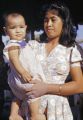 Guam, mother holding child