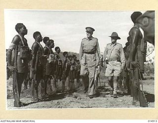 NEW GUINEA: GOVERNOR-GENERAL, LORD GOWRIE, VISITS NEW GUINEA. LORD GOWRIE, INSPECTS A PAPUAN INFANTRY UNIT