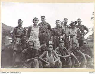 RABAUL, NEW BRITAIN. 1945-11-11. STAFF OF THE VISITORS' AND OBSERVERS' SECTION IN THEIR CAMP AREA NEAR HEADQUARTERS 11 DIVISION AT NAMANULA