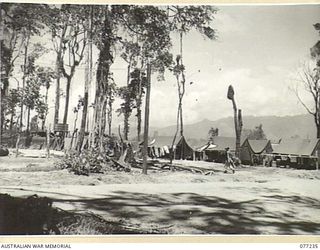 TOROKINA, BOUGAINVILLE ISLAND. 1944-12-24. THE UNIT SHOWERS AND THE SERGEANTS LINES AT THE TEMPORARY CAMP OF HEADQUARTERS, 2ND AUSTRALIAN CORPS