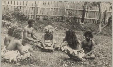 Six Fijian men sitting in a circle, Fiji, approximately 1895