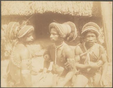 Three men with long hair and calabash containers, Manus Island, Papua New Guinea, probably 1916