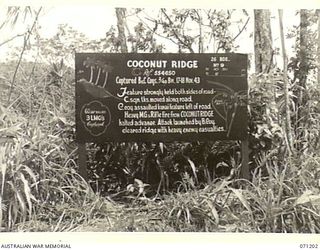 FINSCHHAFEN AREA, NEW GUINEA, 1944-03-17. ONE OF THE MANY BATTLE SIGNS IN THE AREA, THIS SIGN RECORDS ACTIVITIES OF THE 2/48TH INFANTRY BATTALION