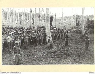 MADANG, NEW GUINEA. 1944-07-01. A JOIN-UP PHOTOGRAPH OF A MORNING PARADE OF THE 24TH INFANTRY BATTALION. TO JOIN TO PHOTOGRAPHS NO. 74436 AND 74437. IDENTIFIED PERSONNEL ARE:- VX57 MAJOR K.A. ..