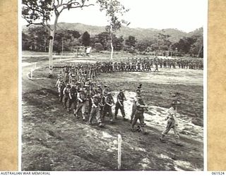 POM POM VALLEY, NEW GUINEA. 1943-11-30. 2/12TH AUSTRALIAN INFANTRY BATTALION, MARCHING OFF THE SHOWGROUND AFTER AN INSPECTION BY THEIR COMMANDING OFFICER QX6008 LIEUTENANT COLONEL C. C. F. BOURNE. ..