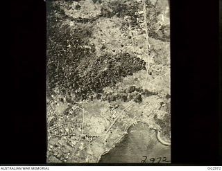 LAE, NEW GUINEA. 1942-08-31. AERIAL PHOTOGRAPH TAKEN DURING A BOMBING ATTACK BY ALLIED FORCES ON A BOMB DUMP