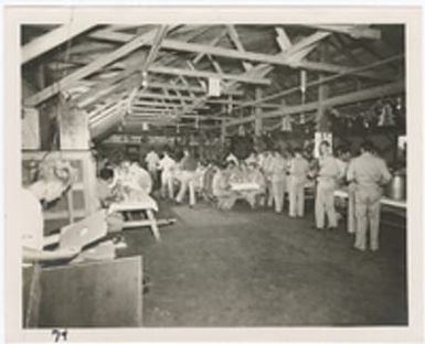 [Servicemen eating in mess hall, Saipan]