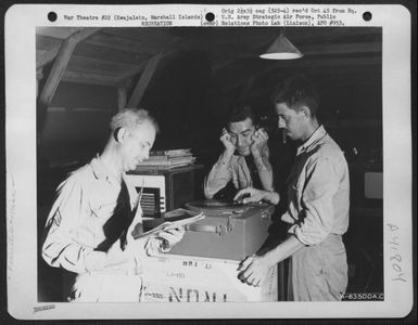 Gi'S Listen To Some Of Their Favorite Recordings. Kajalein, Marshall Islands. 23 April 1944. (U.S. Air Force Number A63500AC)