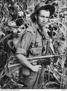 GUY'S POST, FARIA RIVER AREA, NEW GUINEA. 1943-11-08. NX27560 PRIVATE C. G. WILLIAMS OF RANDWICK, NSW, AND OF THE 2/33RD AUSTRALIAN INFANTRY BATTALION, MOVING TO GUY'S POST TO RELIEVE MEMBERS OF ..