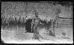 Man in front of house