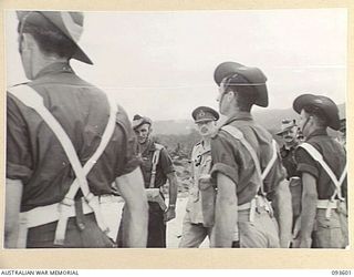 JACQUINOT BAY, NEW BRITAIN, 1945-07-01. HIS ROYAL HIGHNESS, THE DUKE OF GLOUCESTER, GOVERNOR-GENERAL OF AUSTRALIA (2), INSPECTING TROOPS OF 29/46 INFANTRY BATTALION AT WUNUNG AIRSTRIP DURING HIS ..