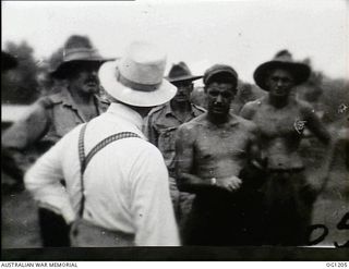 AITAPE, NORTH EAST NEW GUINEA. C. 1944-06. ARTHUR DRAKEFORD, THE MINISTER FOR AIR, TALKING TO RAAF PERSONNEL DURING HIS VISIT TO RAAF UNITS IN THE NEW GUINEA AREA