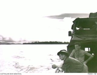 THE SOLOMON ISLANDS, 1945-05. SOME AUSTRALIAN SOLDIERS AT SEA ON BOARD AN ARMY VESSEL OFF NORTH BOUGAINVILLE. (RNZAF OFFICIAL PHOTOGRAPH.)