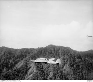 NORTHERN NEW GUINEA. C. 1945-04. BEAUFORT BOMBER AIRCRAFT, CODE KT-Q, OF NO. 7 SQUADRON RAAF IN FLIGHT, CLIMBING INTO THE TORRICELLI RANGES, TO BOMB JAPANESE OCCUPIED POSITIONS AHEAD OF THE ADVANCE ..