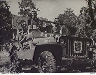 MALMAL VILLAGE, NEW BRITAIN. 1944-12-24. TROOPS OF HEADQUARTERS, 5TH DIVISION ASSISTING CAPTAIN JOHNS, SALVATION ARMY REPRESENTATIVE (1) TO DELIVER AUSTRALIAN COMFORTS FUND CHRISTMAS HAMPERS IN HIS ..