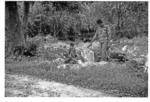 Man and boy stand at stone artifact site 2