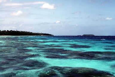 A view of several islands near Guam, taken from the bridge of the salvage ship USS BOLSTER (ARS 38)