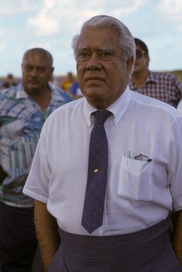 Somoan Governor A.P. Lutali looks on as members of the 22nd Military Airlift Squadron unload an emergency generator and equipment at the Pago Pago International Airport. The generator was airlifted to the island aboard a C-5 Galaxy aircraft