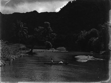 [Pacific Island woman in canoe]