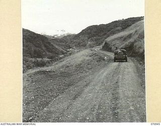 ZENAG PLATEAU, NEW GUINEA, 1944-02-27. THE WAMPIT VALLEY VIEWED FROM THE TOP OF ZENAG PLATEAU ABOUT FOURTY FIVE AND A HALF MILES FROM WAU