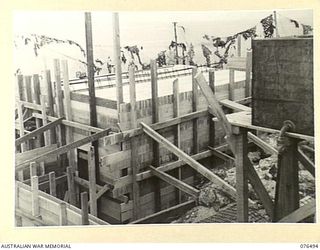 PORT MORESBY, PAPUA. 1944-10-18. THE LEFT REAR OF THE BATTERY OBSERVATION POST FRAMEWORK AND REINFORCING PARTIALLY COMPLETED AT THE BASILISK BATTERY, 801ST ANTI-AIRCRAFT AND COAST ARTILLERY BATTERY