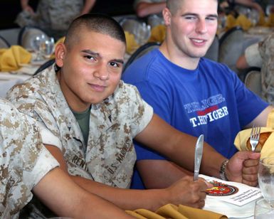 U.S. Marine Corps Lance CPL. I. Rentas along with fellow Marines wait for their turkey dinner at the Sunset Lanai, at Camp H. M. Smith, Hawaii on Nov. 24, 2004.(U.S. Marine Corps photo by Lance Corporal Angela Hitchcock) (Released)