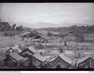 LAE, NEW GUINEA. 1945-12. MEN'S TENT LINES, VEHICLE PARK AND RETURNED STORES DEPOT, 4 ADVANCED ORDNANCE DEPOT