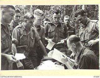 1943-09-14. NEW GUINEA. TROOPS VOTING IN FEDERAL ELECTIONS. WITHIN HALF A MILE OF THE JAPANESE FRONT LINES AT FOODVIEW JUNCTION, AUSTRALIAN TROOPS VOTED IN THE FEDERAL ELECTIONS. THIS PHOTO SHOWS ..