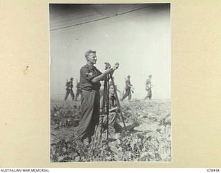 MOTUPINA POINT AREA, BOUGAINVILLE ISLAND. 1945-01-19. VX115255 SERGEANT R.M. PARNABY (1) AND NX102614 GUNNER J.E. TURNBULL (2) METROLOGICAL SECTION, 3RD SURVEY COMPANY ATTACHED TO NO.6 BATTERY, 2ND ..