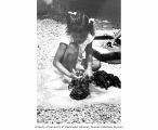 Rongelap girl washing clothes, summer 1964