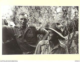 SHAGGY RIDGE, NEW GUINEA. 1944-01-10. QX4398 CAPTAIN ALEC MARSHALL, MC., (1) A COMPANY COMMANDER OF THE 2/9TH INFANTRY BATTALION TOGETHER WITH QX6064 MAJOR E.W. FLEMING THE SECOND IN CHARGE OF THE ..