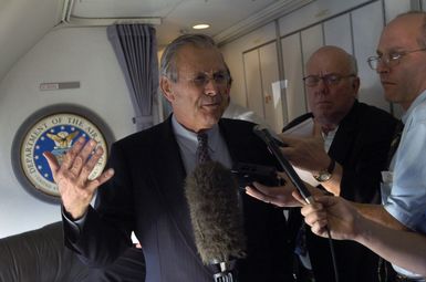 The Honorable Donald H. Rumsfeld, U.S. Secretary of Defense, answers a question during a press briefing, at Anderson Air Force Base, Guam, on Nov. 14, 2003. (DoD photo by TECH. SGT. Andy Dunaway) (Released)