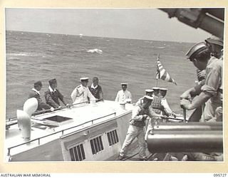 AT SEA OFF RABAUL, NEW BRITAIN. 1945-09-04. JAPANESE NAVAL LAUNCH DRAWING AWAY FROM HMAS VENDETTA, AFTER PRE- SURRENDER DISCUSSIONS ABOARD HMAS VENDETTA AT A SEA RENDEZVOUS OFF RABAUL BETWEEN ..