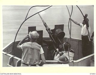 AT SEA. 1944-05-12. ONE OF THE SIX OERLIKON GUNS ABOARD THE TROOPSHIP ORMISTON FIRING DURING ANTI-AIRCRAFT PRACTICE ON THE VOYAGE FROM PORT MORESBY TO LAE