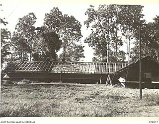 LAE, NEW GUINEA. 1945-02-06. THE NEW SIGNALS OFFICE OF HEADQUARTERS, FIRST AUSTRALIAN ARMY. THE RIGHT WING IS THE WIRELESS OPERATING ROOM THE LEFT WING HOUSES THE LINE INSTRUMENT OPERATORS, CLERKS ..