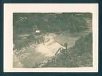 View of river, showing camp with buildings in background, [Bulolo?], New Guinea, c1932 to 1933