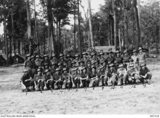 Group portrait of members of the staff of Battalion Headquarters, 58/59 Infantry Battalion. Identified, back row, left to right: VX138109 Corporal (Cpl) Walter Ronald Gorman MM; Sergeant (Sgt) M ..