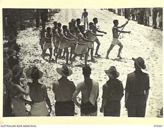 KELANOA, NEW GUINEA, 1944-02-20. MEMBERS OF THE 2/14TH FIELD REGIMENT, PLACED SECOND IN THE MARCHPAST, AND WINNERS AT THE COMBINED SPORTS, PICTURED AT THE MOST FORWARD BEACH CARNIVAL HELD IN NEW ..