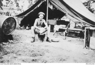 Port Moresby, Papua. 1942. Washing day for Sergeant F. G. Cassidy, a navigator of No. 30 Squadron RAAF. Sgt Cassidy's tent was typical of accommodation available to members of the Squadron at ..