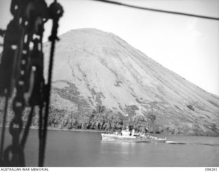 BLANCHE BAY, RABAUL, NEW BRITAIN. 1945-09-10. THE RAN CORVETTE HMAS KIAMA (J353) PASSING THE VOLCANO SOUTH DAUGHTER. THE KIAMA IS ONE OF THE VESSELS ESCORTING THE CONVOY CARRYING TROOPS FOR THE ..