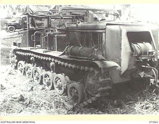 MADANG - ALEXISHAFEN ROAD, NEW GUINEA. 1944-05-26. THE SIDE VIEW OF A JAPANESE ARMOURED TRACTOR, (POWERED BY A DIESEL ENGINE OF GERMAN DESIGN) WHICH WAS ABANDONED ON THE ROAD NEAR MILILAT ..