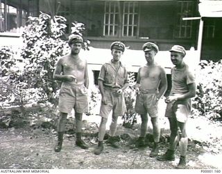 BISMARCK ARCHIPELAGO, 1945. FOUR NAVAL PERSONNEL AT EMIRAU ISLAND. (RNZAF OFFICIAL PHOTOGRAPH.)