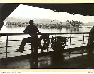 MILNE BAY, NEW GUINEA, 1944-03-15. MILNE BAY FROM THE BOAT DECK OF HT TAROONA WITH LAULAU ISLAND IN THE FOREGROUND