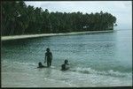 Children swimming at the coast